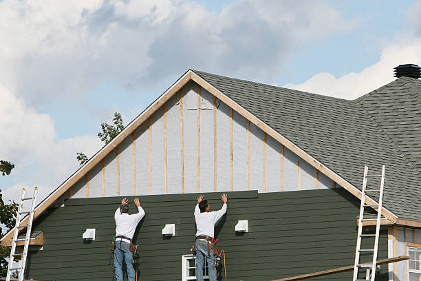 Professional Siding Installation technician working in Valley Stream, NY